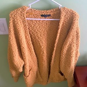Yellow cardigan - mid length - warm and fun material